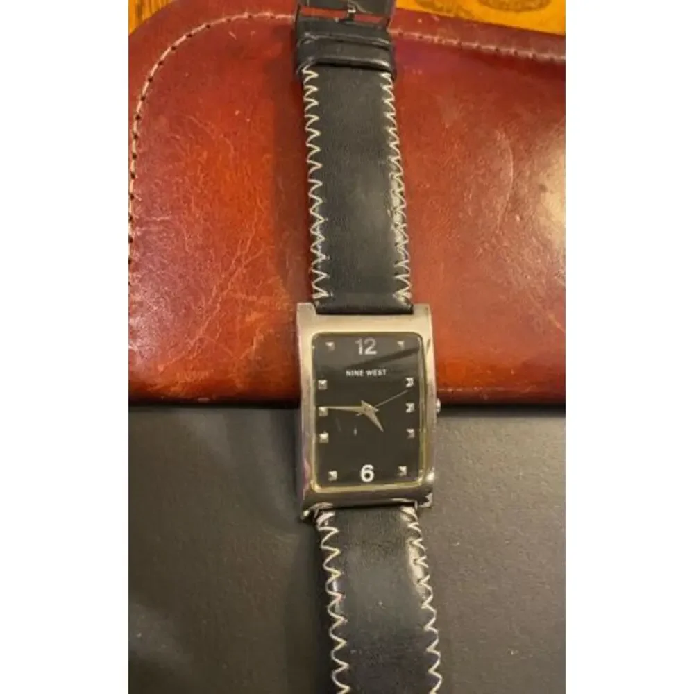 Women's Silver tone 25mm Nine West Watch, Black Face and Stitched Band